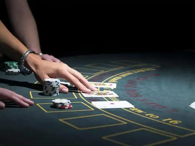 Multi-camera live-dealer studio with professional croupier at baccarat table